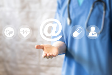 Doctor pushing button mail healthcare network on virtual panel medicine