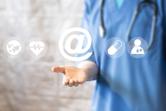 Doctor pushing button mail healthcare network on virtual panel medicine