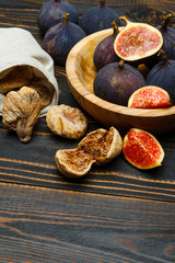 Fresh and dried Fig isolated on wooden background