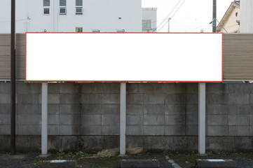Large blank billboard on a street wall, banners with room to add your own text
