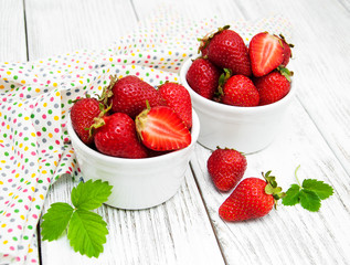 ripe strawberries on wooden table