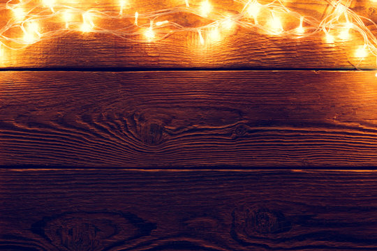 Picture of wooden surface with burning garland