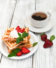 belgian waffles with strawberries and mint