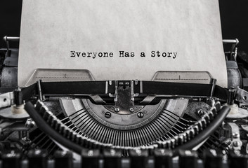 Everyone Has a Story typed words on a old vintage typewriter. Close up © gerasimov174
