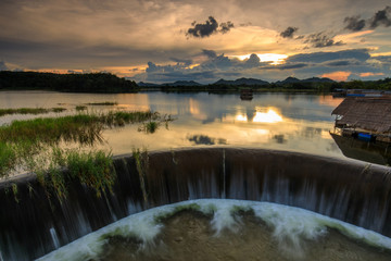 Beautiful sunset on  lake in the hill.