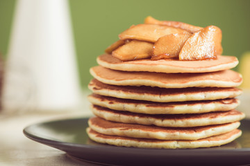 Pancakes with apple on table. Breakfast, snacks. Pancakes Day.