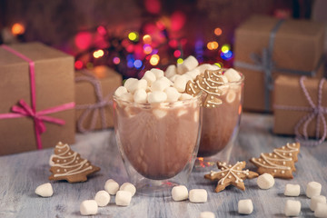 Hot chocolate with marshmallows and gingerbread cookies, christmas hot drink and gift boxes, winter hot drink