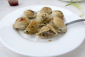 Fried dumplings on a plate.