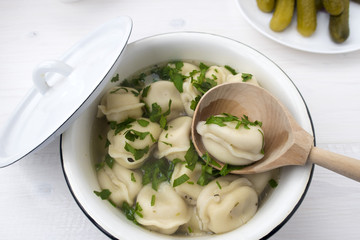 Appetizing dumplings with meat in broth.