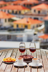 Madeira wine, coffee and hohey cake, View to Funchal, Portugal