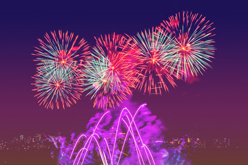 Beautiful colored fireworks display on dark sky background.