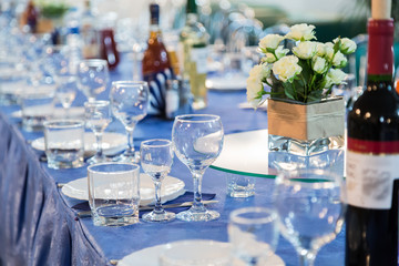 Served tables at the Banquet. Drink, alcohol, delicacies and snacks. Catering. A reception event.