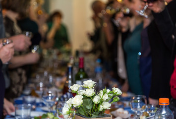 The people at the Banquet. A solemn event in the enterprise. Anniversary or wedding. Snacks and alcohol on the tables. Served buffet style. Catering.