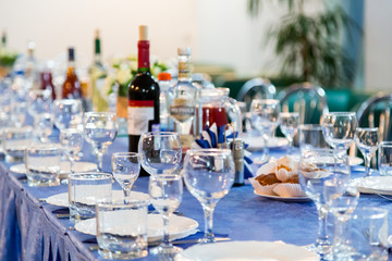 Served tables at the Banquet. Drink, alcohol, delicacies and snacks. Catering. A reception event.