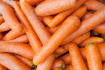 A pile of carrot in supermarket as background