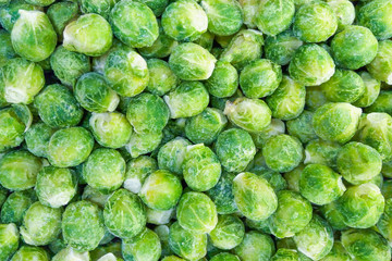 A pile of frozen Brussels sprouts as background
