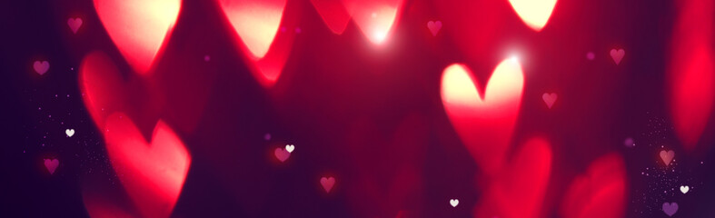 Valentine's Day background. Holiday abstract background with red glowing hearts