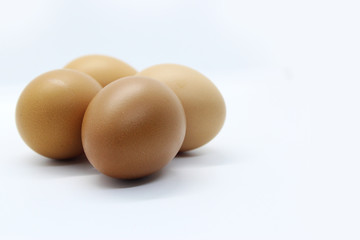 Close-up view of organic Brown Eggs on Plastic Egg Carton isolated on white background