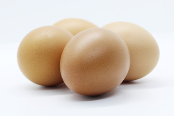 Close-up view of organic Brown Eggs on Plastic Egg Carton isolated on white background