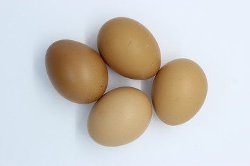 Close-up view of organic Brown Eggs on Plastic Egg Carton isolated on white background