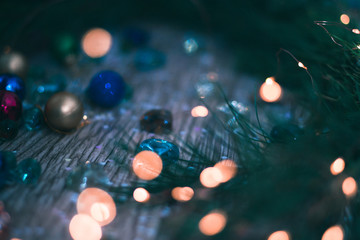 Christmas decorations on a wooden background with branches of a Christmas tree.