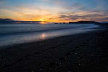 Fototapeta na wymiar black sand beach sunset