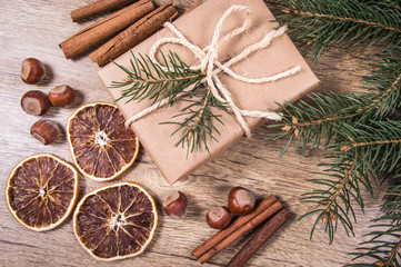 Christmas gifts in rustic boxes on wooden background.