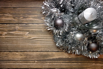 Fototapeta na wymiar Christmas or New Year`s background with silver ornaments on table