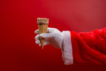 santa claus holding an ice cream cone on red