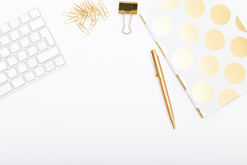 Workplace with golden objects. Copy space