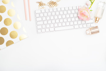 Workplace girl with pink-gold objects on white background. Copy space