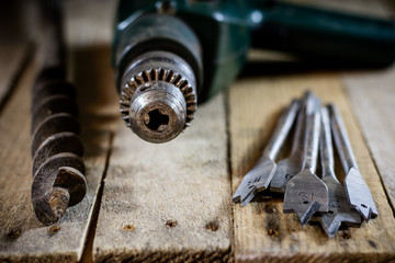 Old good carpentry, tools drill bit. Wooden carpentry table and old good carpentry tools on it.