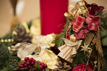 Christmas composition:
Details on yule wreath – mistletoe, angel, Christmas  greens.
