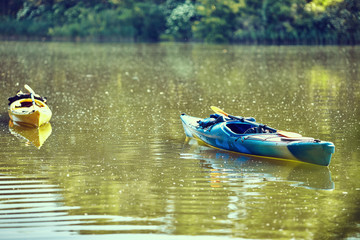 Kayaks moored in the water. Empty kayaks without people.