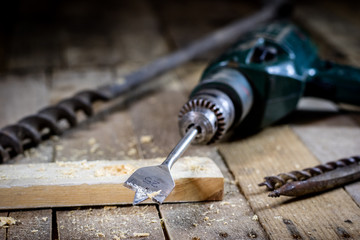 Old good carpentry, tools drill bit. Wooden carpentry table and old good carpentry tools on it.