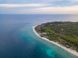 Fototapeta na wymiar Aerial view of Gili Trawangan Island coastline with boats and buildings, West Nusa Tenggara, Indonesia