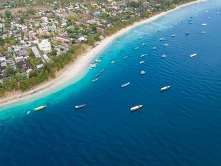 Papier Peint photo Lavable Photo aérienne Aerial view of Gili Trawangan Island coastline with boats and buildings, West Nusa Tenggara, Indonesia