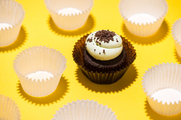 Birthday cupcake against a yellow background