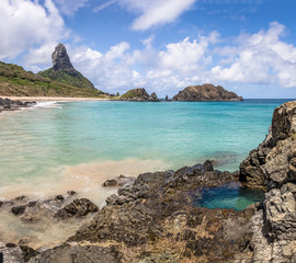 Buraco do Galego (Galego Hole) at Praia do Cachorro Beach with Morro do Pico on background - Fernando de Noronha, Pernambuco, Brazil.