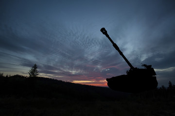 War Concept. Military tank silhouette scene on sky background