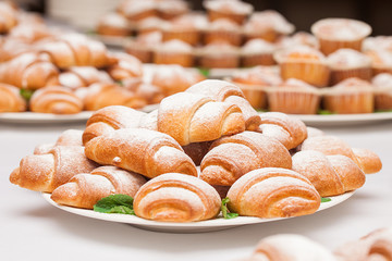 croissants with sugar powder on the table