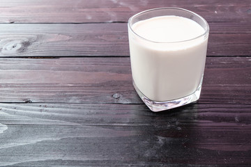 Fresh milk on wooden background