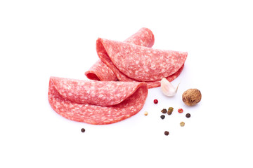 Salami smoked sausage slices isolated on white background with herbs