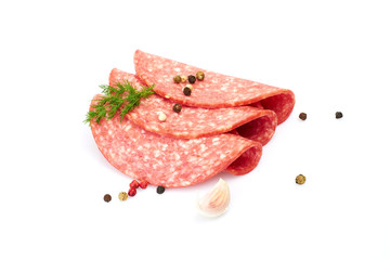 Salami smoked sausage slices isolated on white background with herbs