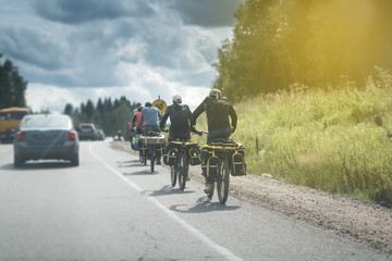 bicycle travelers on the road under the sun