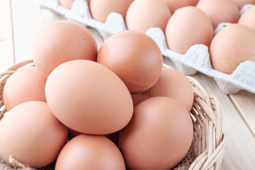fresh chicken egg on wooden background