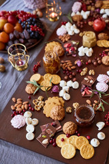 Delicious sweets on candy buffet. different sweets on a wooden table