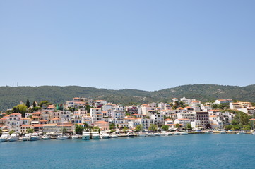 Skopelos island seaside coastline town with buildings, typical greek view, Greece
