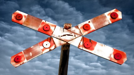 Ralway crossing label sign with cloudy sky © Serdar