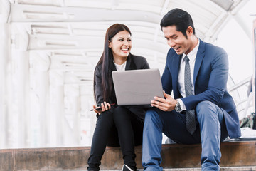 Image of two businessmen talking and working together